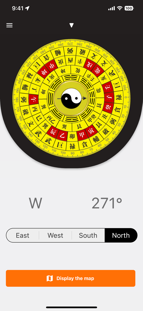 Digital compass interface with a traditional yellow and red Feng Shui fortune design and a Yin Yang symbol center.