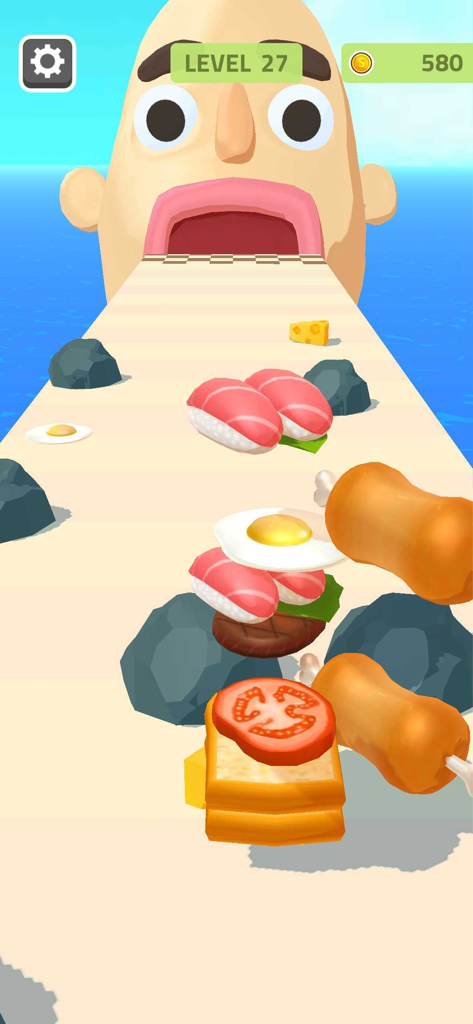 Sandwich Runner - Ein Gameplay-Bildschirm von Sandwich Runner, der zeigt, wie ein hohes Sandwich mit verschiedenen Zutaten auf einer Strecke zu einem riesigen Mund aufgebaut wird