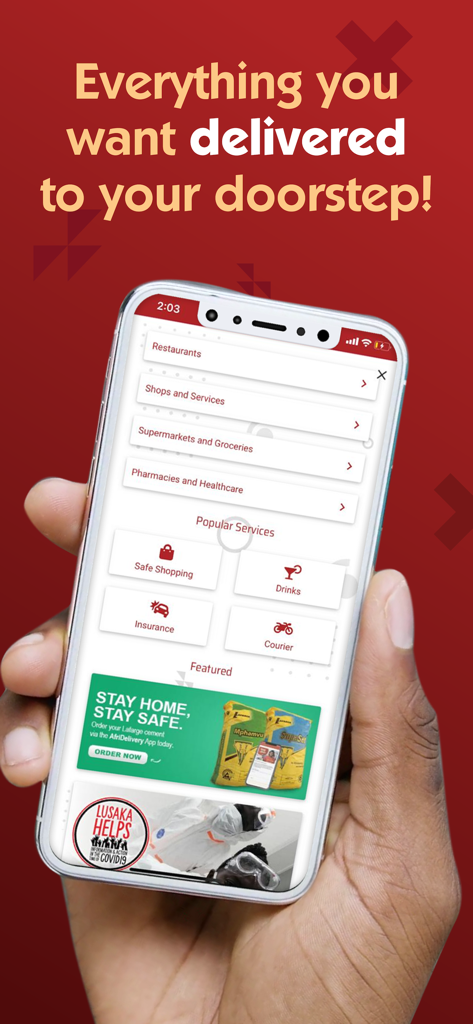 A hand holding a smartphone displaying the AfriDelivery app interface with options for restaurant, grocery, and pharmacy delivery.