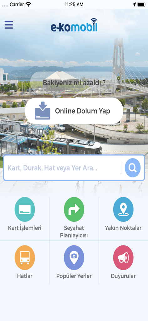 The home screen of the e-komobil transit app featuring options for online card refills and a travel planner