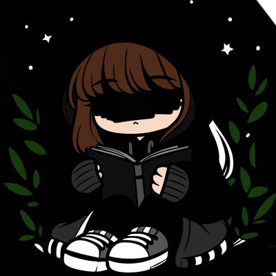 girl in oversized hoodie reading a book