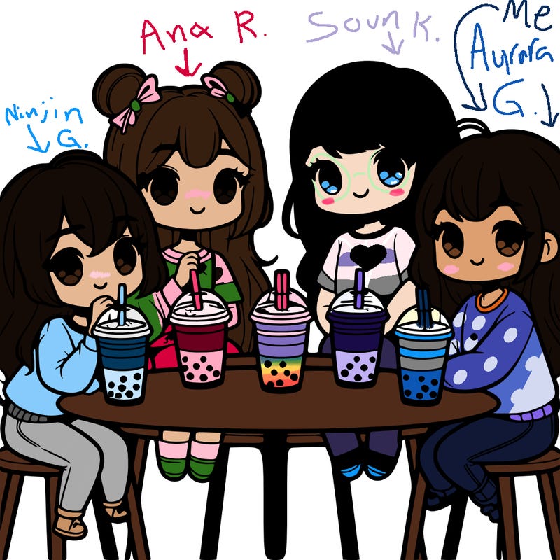 four cute teenage girls sitting at a table drinking boba tea