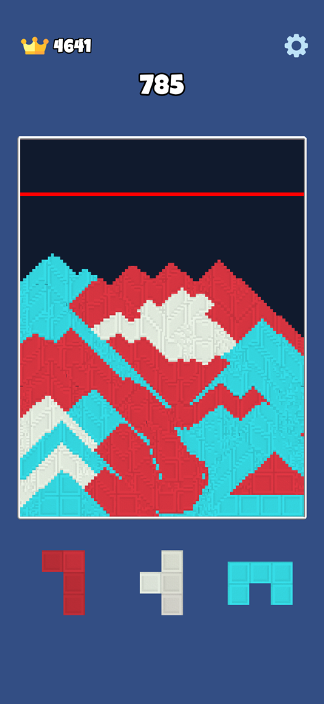 Jugabilidad de Sandy Blocks mostrando partículas de arena rojas, blancas y azules llenando una cuadrícula de puzle