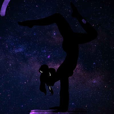 a woman doing a handstand