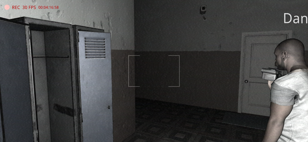 A character holding a camcorder in a dark school hallway with metal lockers in The Ghost multiplayer horror game