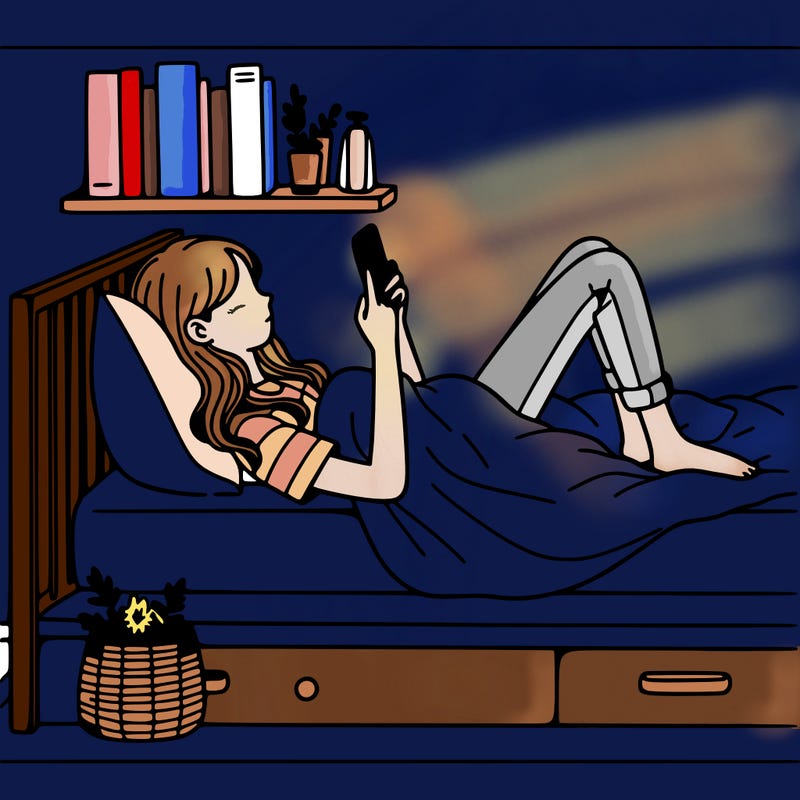 a girl laying on her bed with her phone