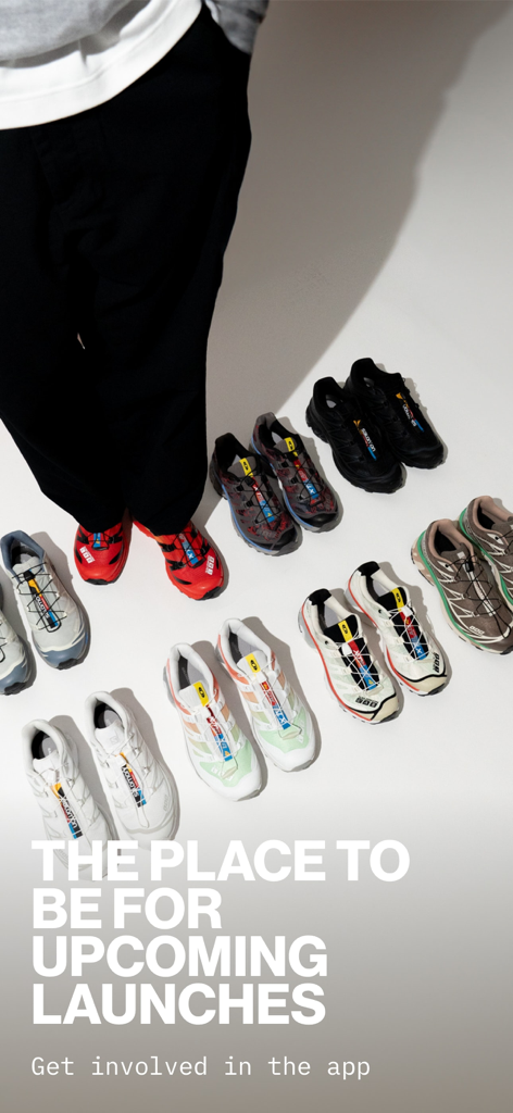 A variety of colorful sneakers arranged on a white floor with text about upcoming launches in the Footpatrol app