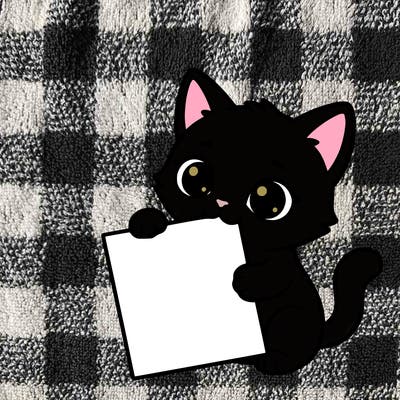 a small cat with a blank sheet of paper in its hand. the cat is sooooooo cute!