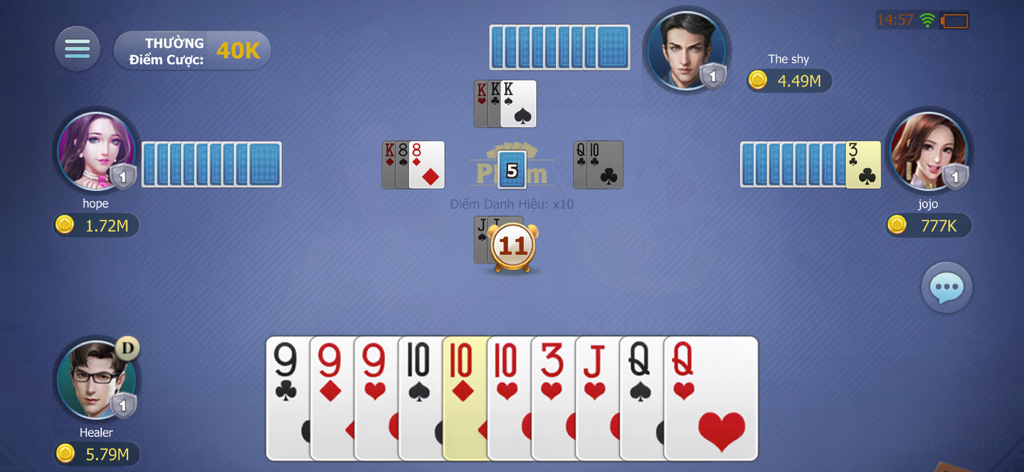 phom - Gameplay of the Phom card game showing four players at a table with cards and virtual coin balances