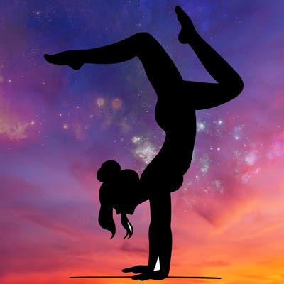 a woman doing a handstand