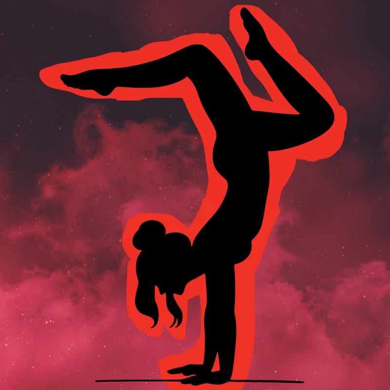 a woman doing a handstand