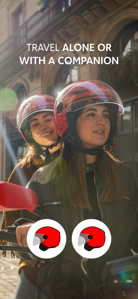 ACCIONA motosharing movilidad - Two people wearing red helmets sharing an electric scooter ride in a city