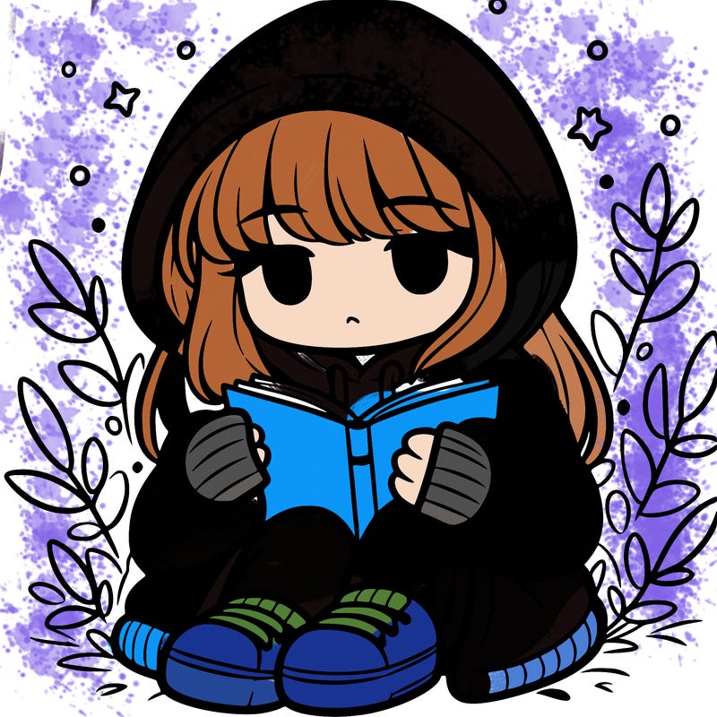 girl in oversized hoodie reading a book