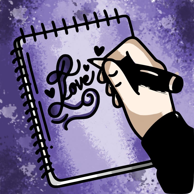a hand writing “love” in calligraphy on a notebook