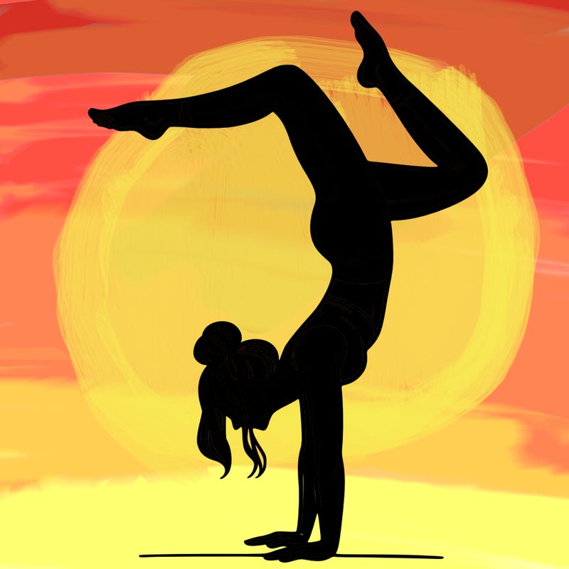 a woman doing a handstand