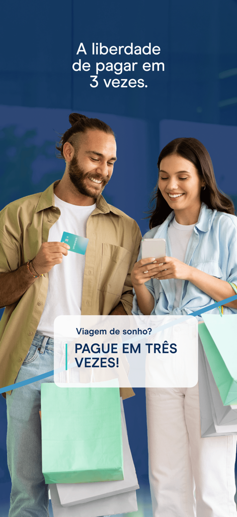 APP UNIBANCO - Two people with shopping bags using the Unibanco app for three-part installment payments