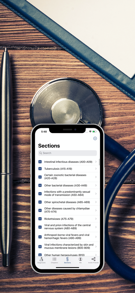 A smartphone showing medical diagnosis sections from the ICD-10 app next to a stethoscope and pen