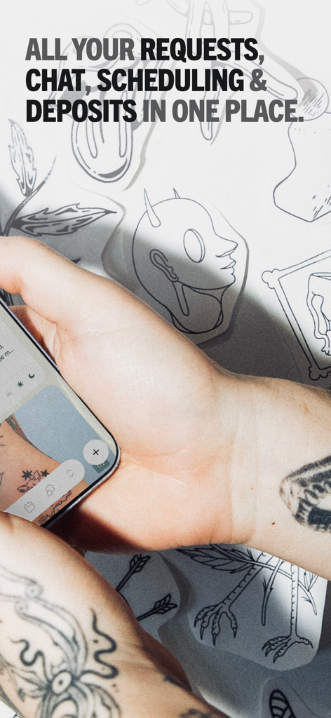 A tattoo artist using the Venue Ink app on a smartphone to manage client requests and deposits