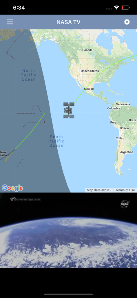 ISS Live Now - The ISS Live Now app interface showing a real-time tracking map of the International Space Station above Earth and a live video feed from space