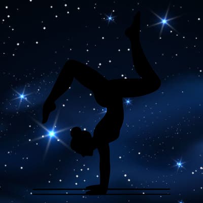 a woman doing a handstand