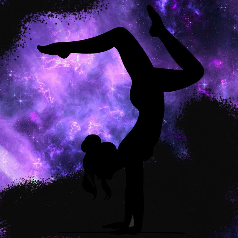 a woman doing a handstand