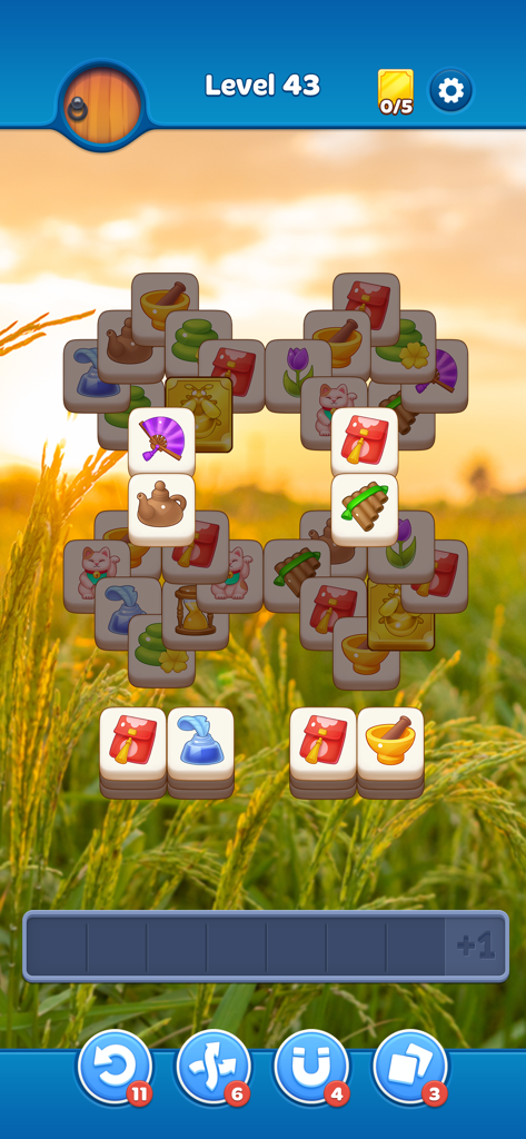Zen Match mobile game showing a tile matching puzzle with a peaceful sunset background