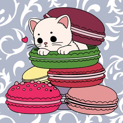 a kitten popping out of a stack of pastel macarons