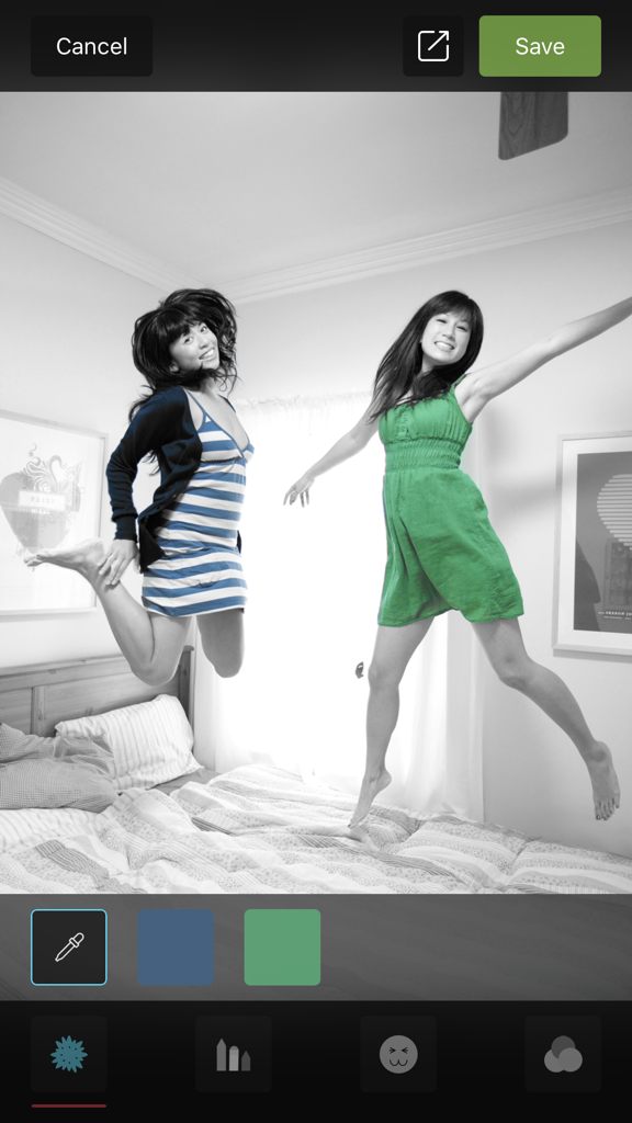Color Accent - Interface of Color Accent app showing a black and white photo of two girls jumping with selective blue and green colors highlighted.