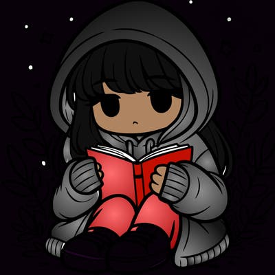 girl in oversized hoodie reading a book
