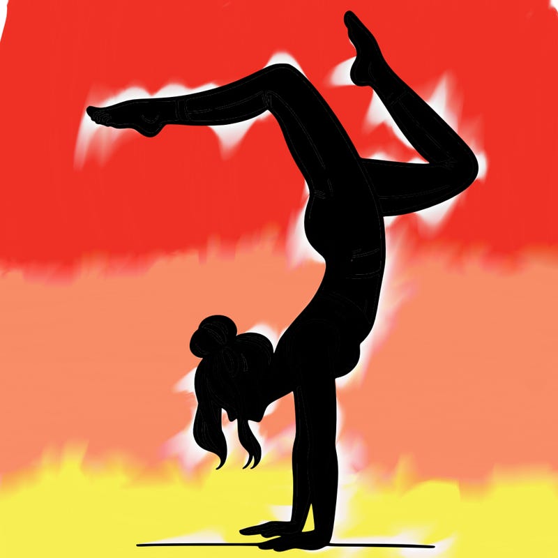 a woman doing a handstand