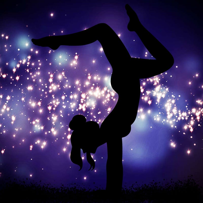 a woman doing a handstand