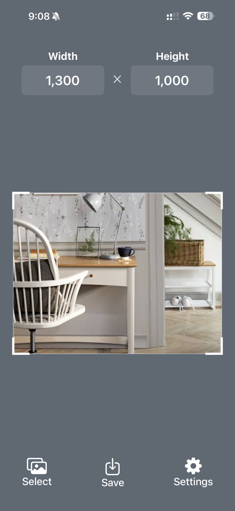 Interface of the Photo Size Editor app showing a photo of a desk being resized to 1300 by 1000 pixels