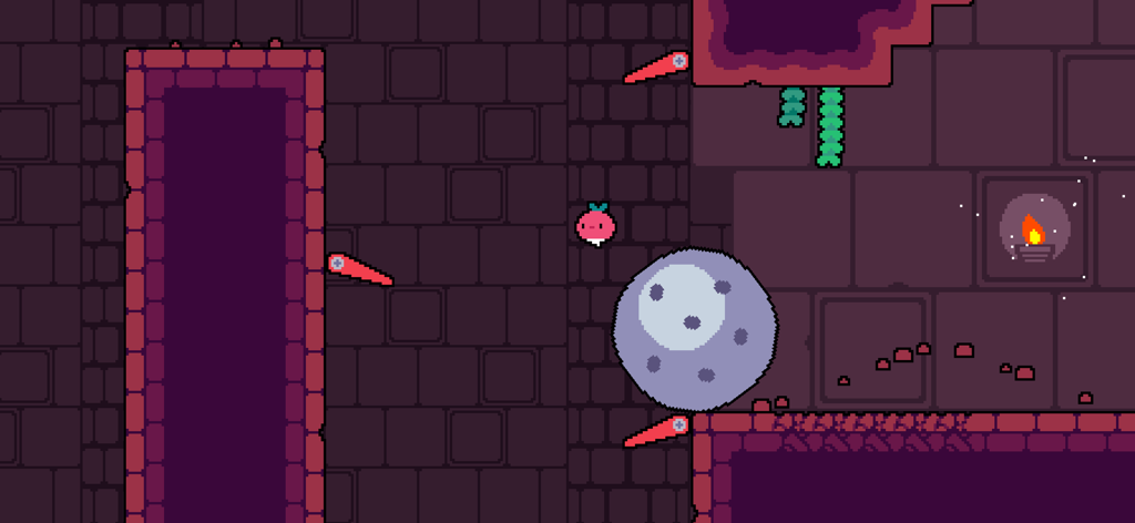 Dadish navigating a retro pixel art level with spikes and a giant boulder