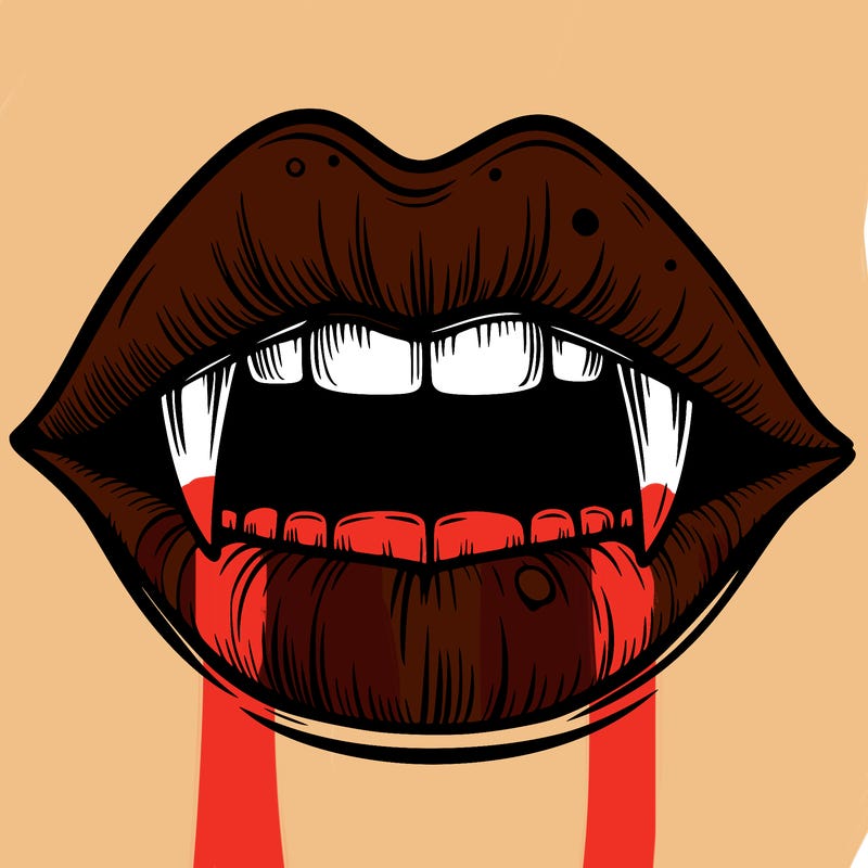 lips with vampire teeth