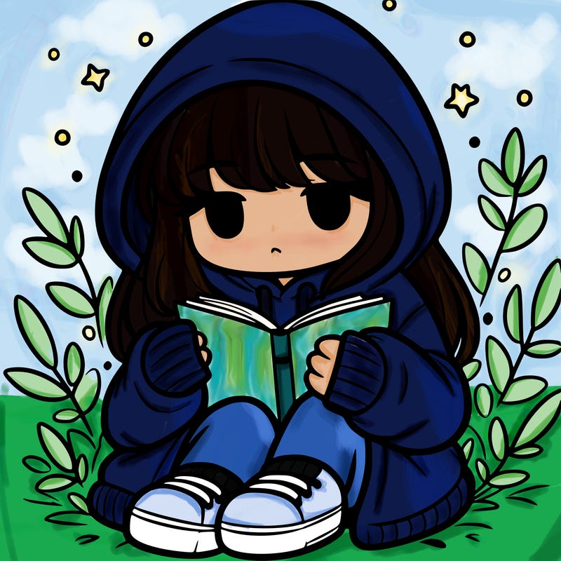 girl in oversized hoodie reading a book