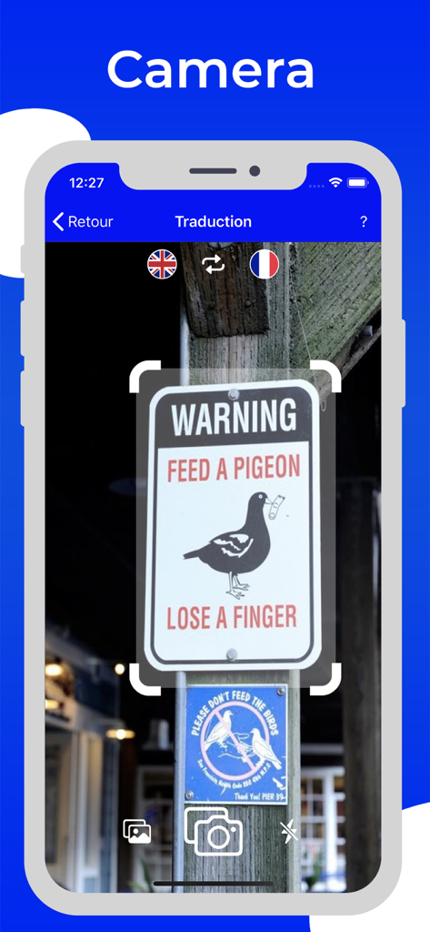 Translate and Translation - A smartphone using the camera translation feature to scan a warning sign about pigeons.