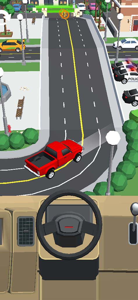 A red pickup truck driving on a road with a split view of the steering wheel and dashboard
