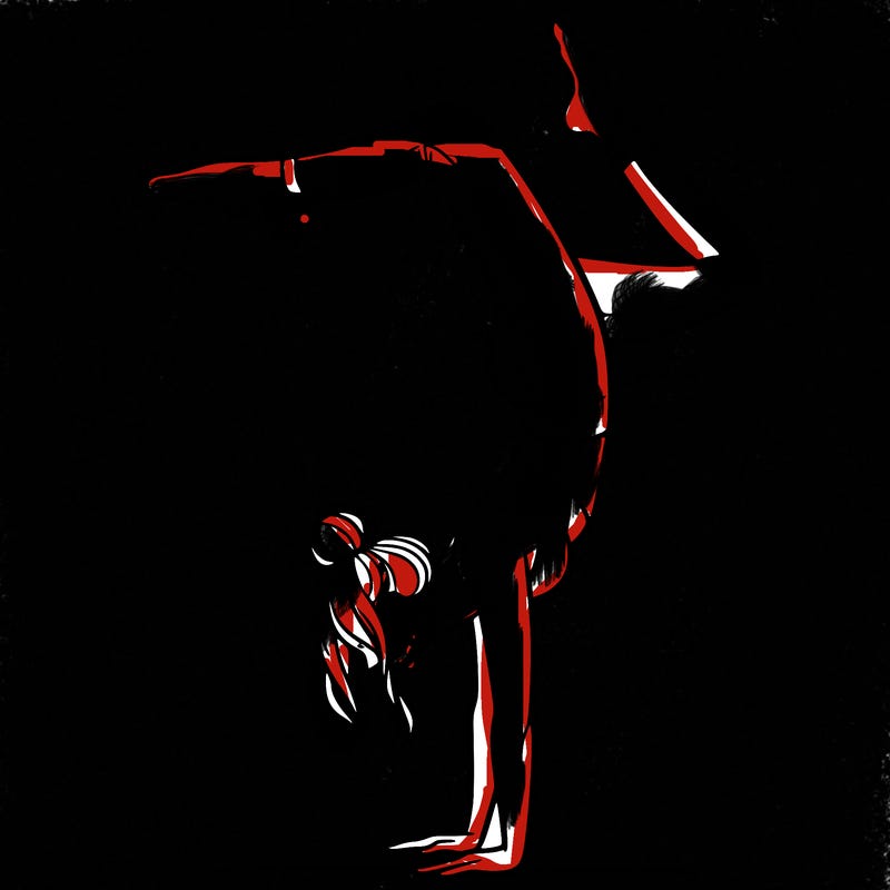 a woman doing a handstand