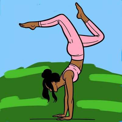 a woman doing a handstand
