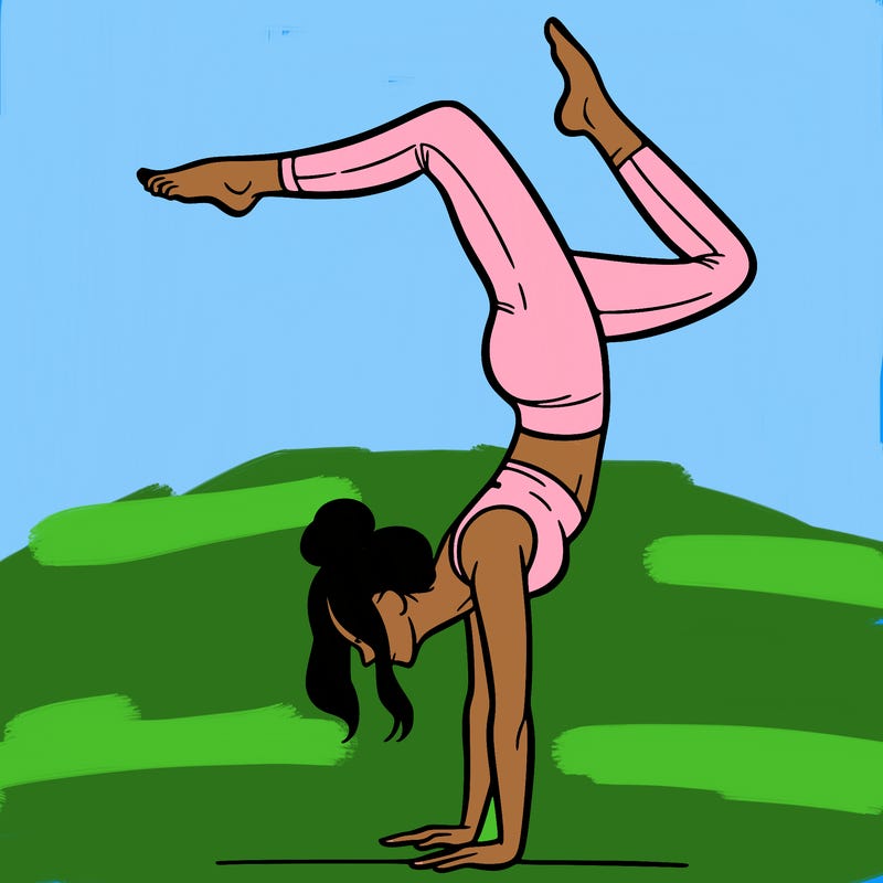 a woman doing a handstand