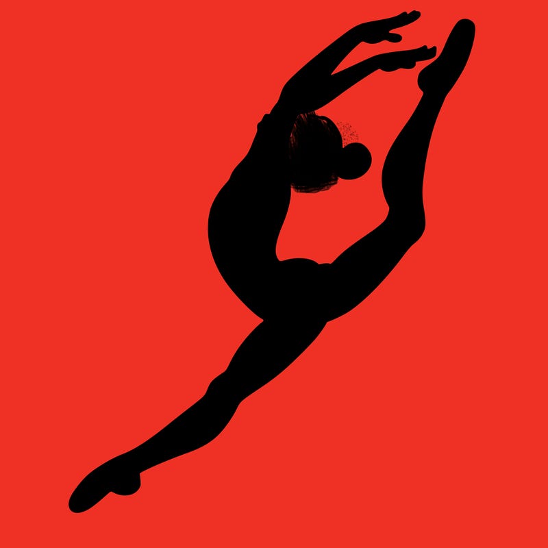 gymnast doing a leap in a leotard with a bent back leg