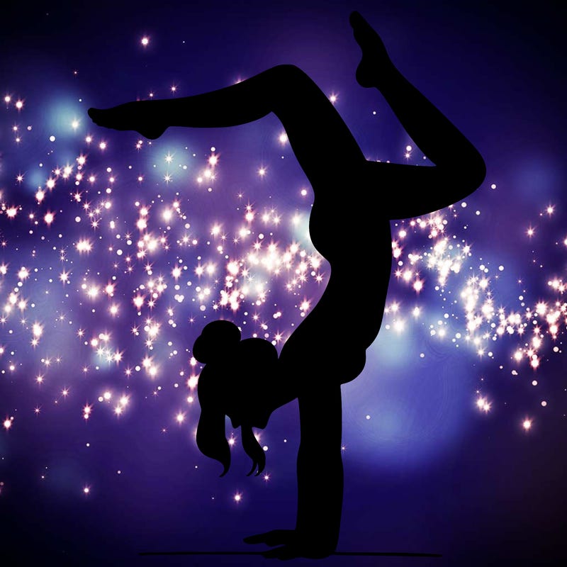 a woman doing a handstand