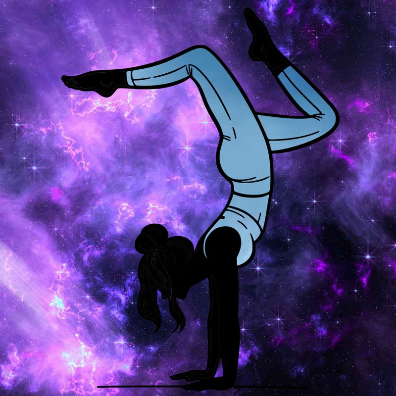 a woman doing a handstand