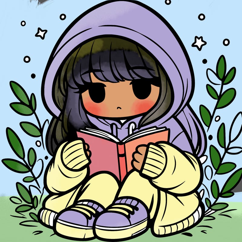 girl in oversized hoodie reading a book