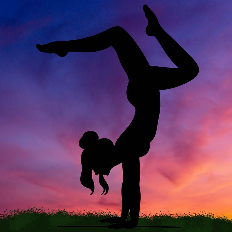 a woman doing a handstand