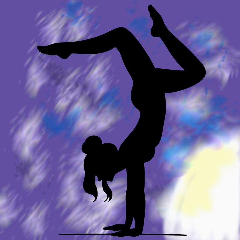 a woman doing a handstand