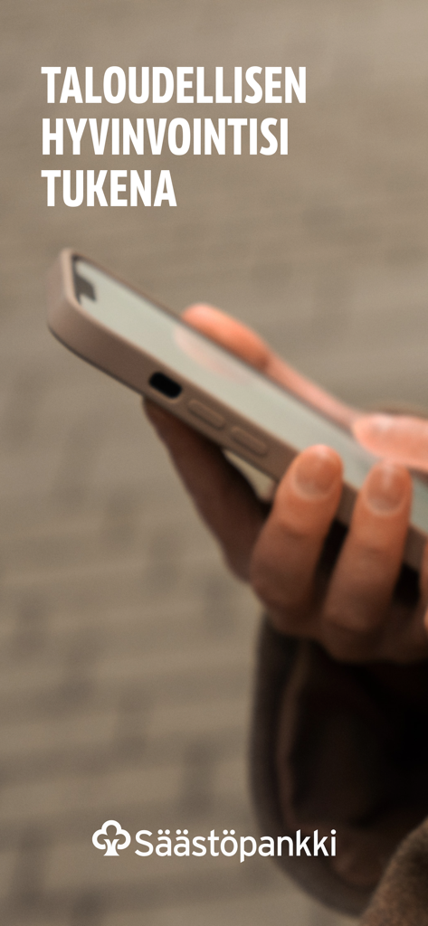 Person holding a smartphone with the Saastopankki logo and Finnish text about supporting financial well being