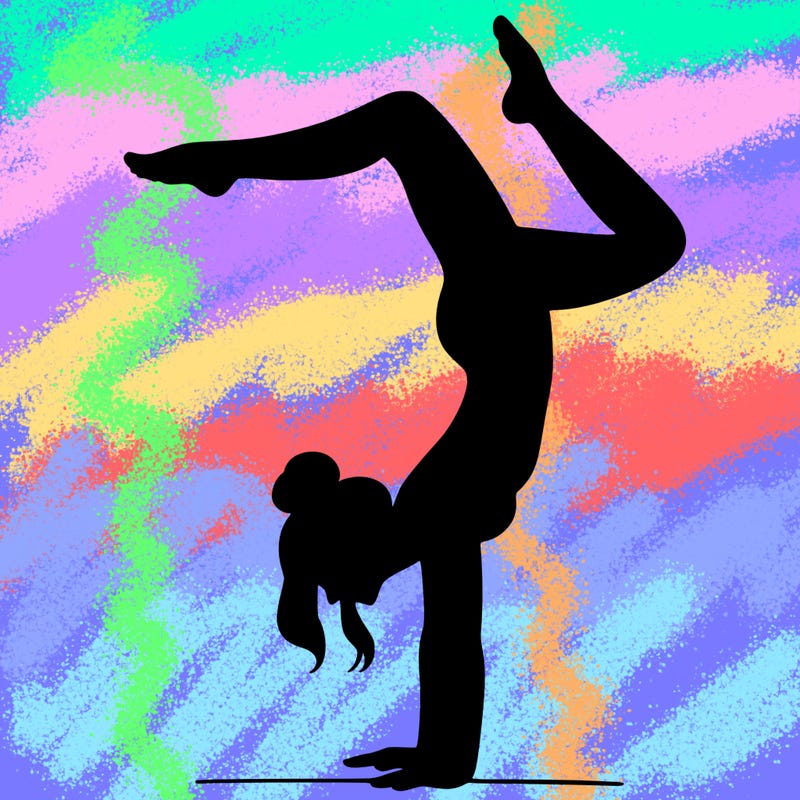 a woman doing a handstand