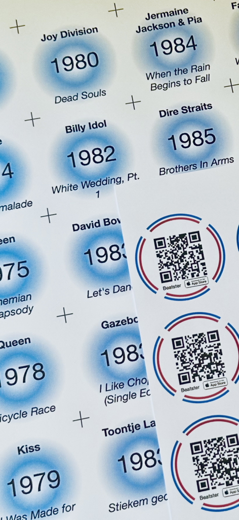 Beatster - Printed music trivia cards showing artist names, release years, and QR codes for the Beatster app.