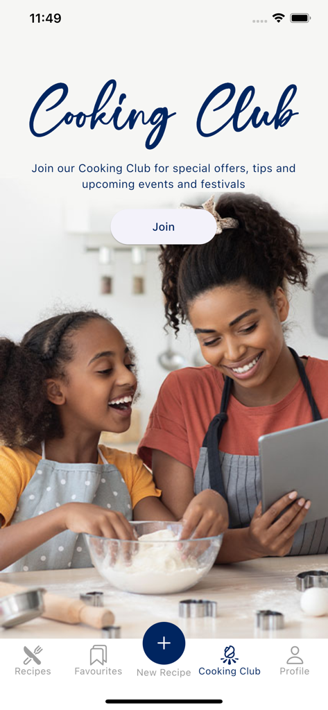 Courts Cook App - A woman and young girl cooking together in a kitchen using a tablet to follow a recipe in the Courts Cook App